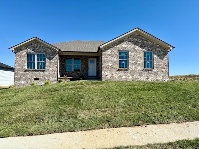 ranch-style home with a front lawn