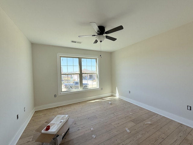 unfurnished room with ceiling fan and light hardwood / wood-style flooring