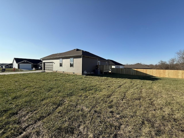 view of property exterior featuring a lawn and central AC unit