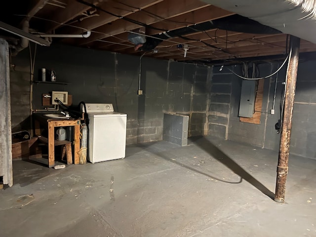 basement with washer / clothes dryer and electric panel