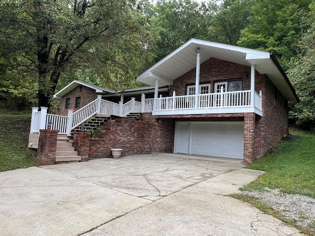 view of front facade featuring covered porch and a garage