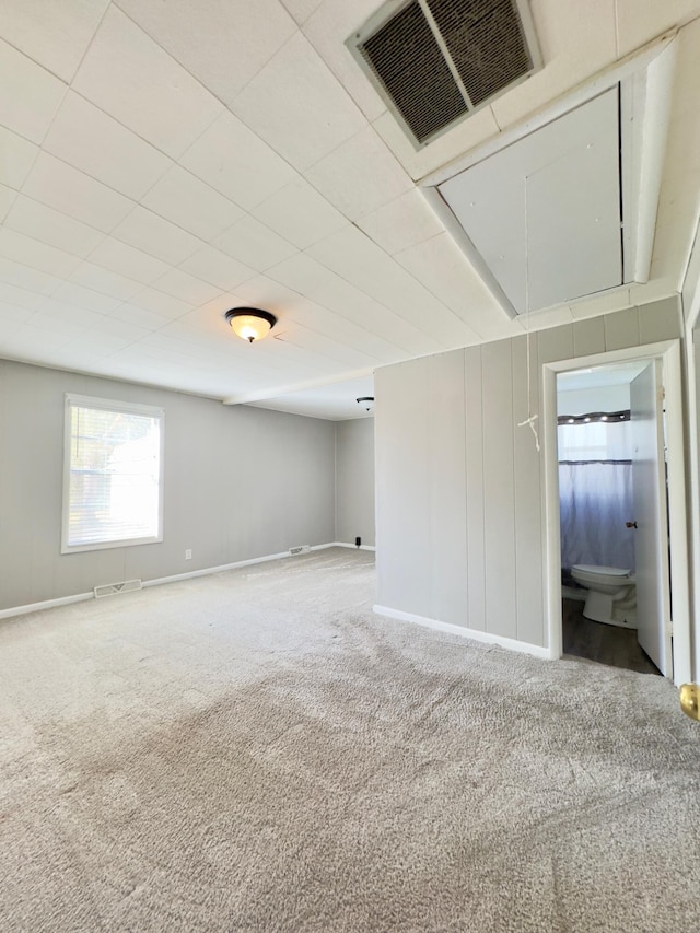 unfurnished room with carpet floors