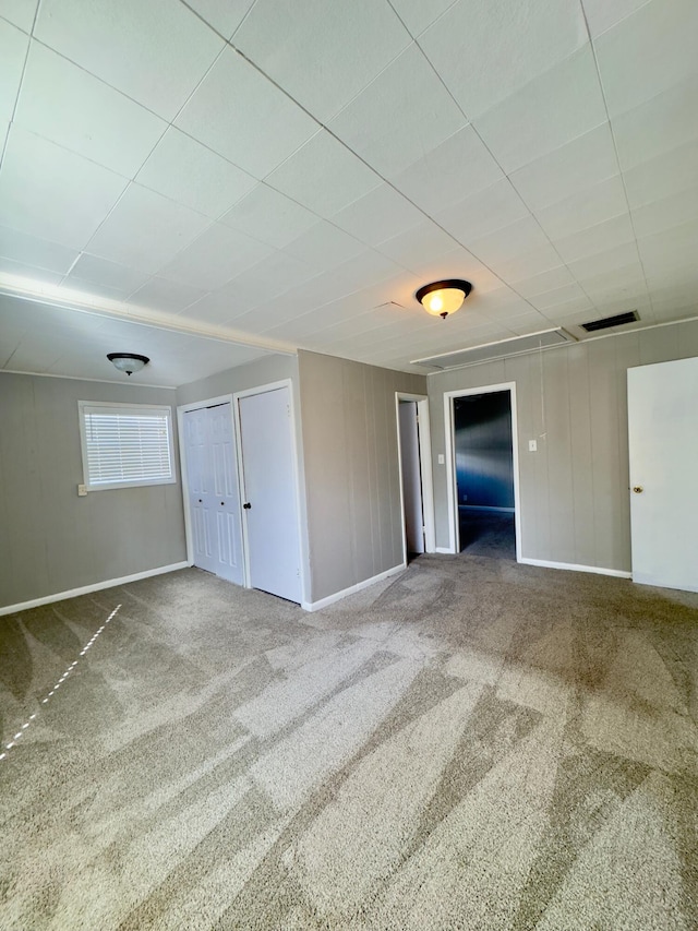 unfurnished bedroom with carpet flooring