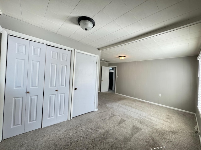 unfurnished bedroom featuring carpet flooring