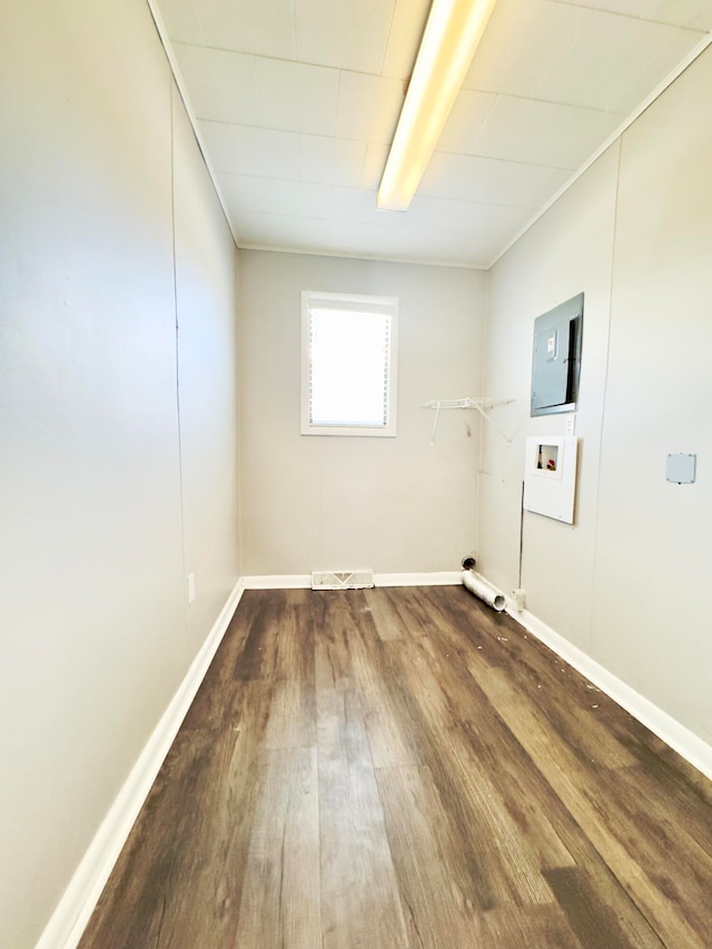 clothes washing area with wood-type flooring and hookup for a washing machine