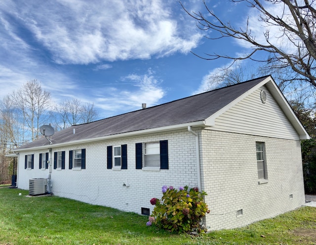 view of property exterior featuring a lawn and cooling unit