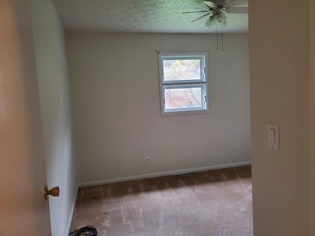 unfurnished room featuring carpet and ceiling fan