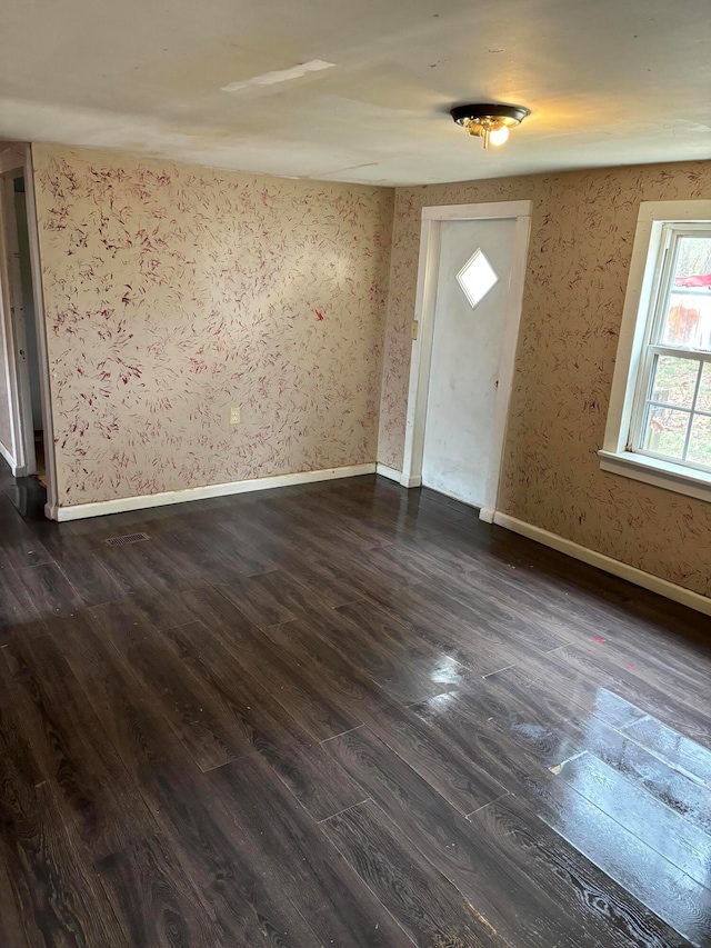 entrance foyer featuring dark hardwood / wood-style floors