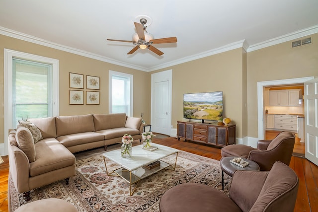 living room featuring ceiling fan, hardwood / wood-style floors, and ornamental molding