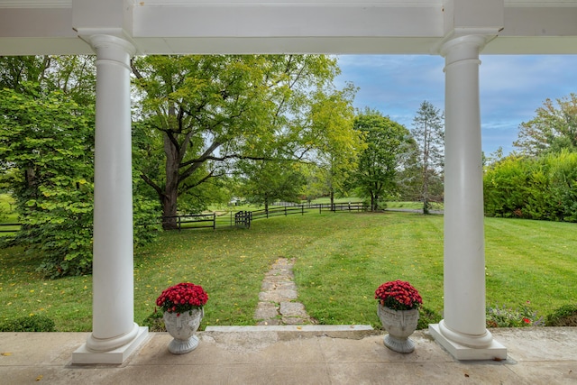 colonial home featuring covered porch and a front yard