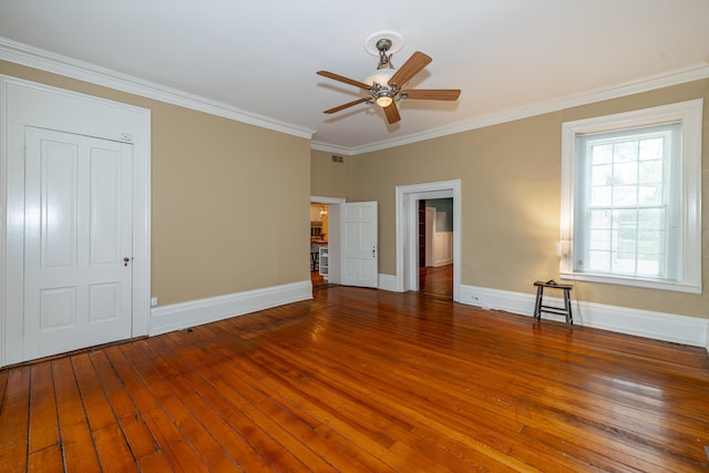 interior space featuring ceiling fan, ornamental molding, and hardwood / wood-style flooring