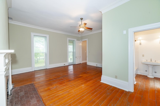 unfurnished living room with ceiling fan, crown molding, and hardwood / wood-style floors