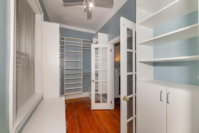 walk in closet featuring french doors, ceiling fan, and wood-type flooring