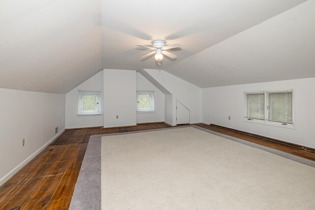 bonus room featuring ceiling fan, dark hardwood / wood-style flooring, and lofted ceiling