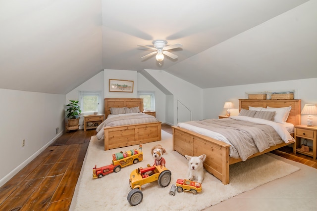 bedroom with ceiling fan, dark hardwood / wood-style floors, and lofted ceiling