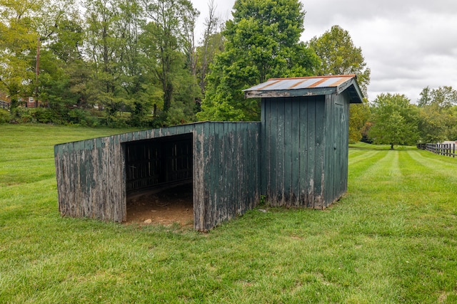 view of outbuilding with a yard