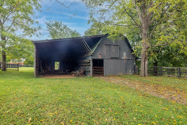 view of outdoor structure featuring a lawn