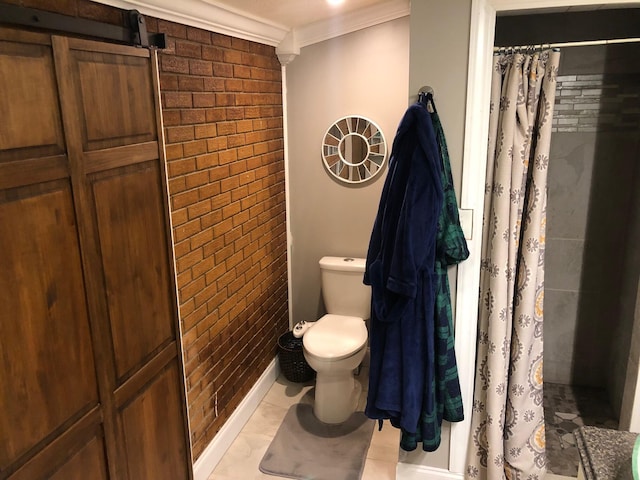 bathroom with crown molding, a shower with shower curtain, toilet, and brick wall