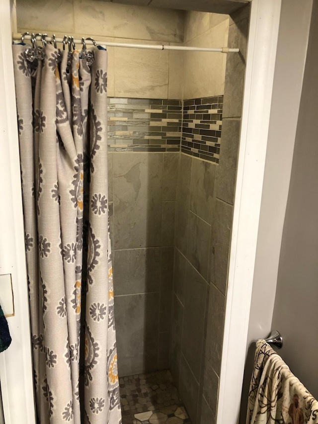 bathroom featuring a stall shower