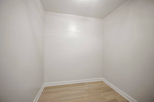 unfurnished room with light hardwood / wood-style floors