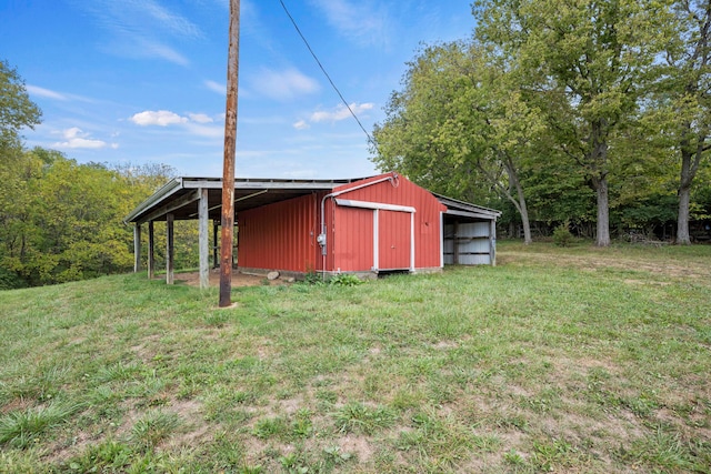 view of outdoor structure featuring a lawn