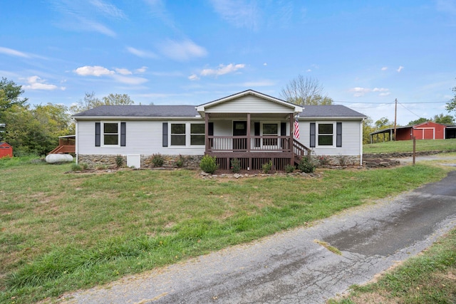 single story home featuring a porch and a front lawn