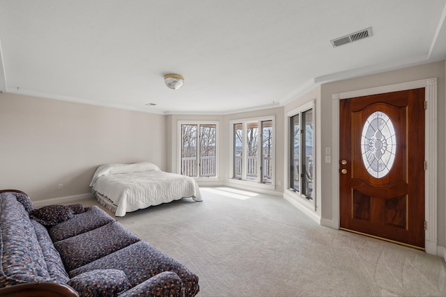 carpeted bedroom with ornamental molding, multiple windows, and access to exterior