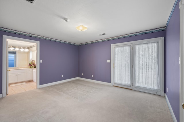 carpeted empty room with a wealth of natural light