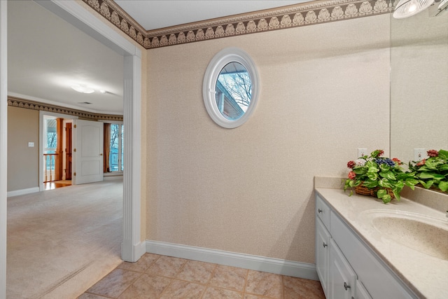 bathroom featuring vanity, tile patterned flooring, and ornamental molding