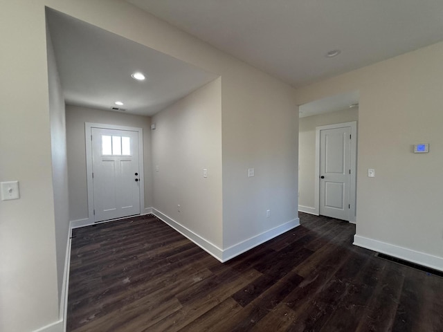 foyer with dark wood-type flooring