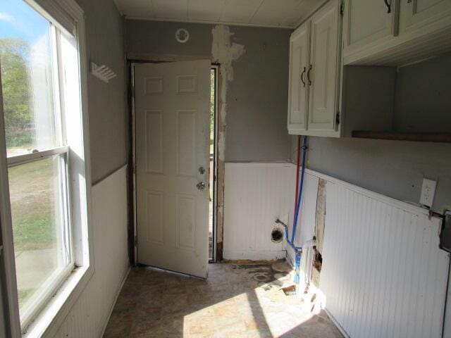 empty room with dark hardwood / wood-style flooring, a textured ceiling, and lofted ceiling