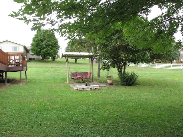 view of yard with a fire pit and a deck