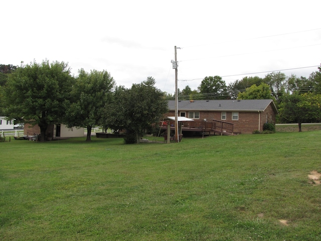 view of yard with a deck