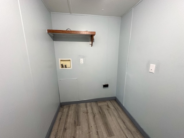 laundry area with washer hookup and light hardwood / wood-style flooring