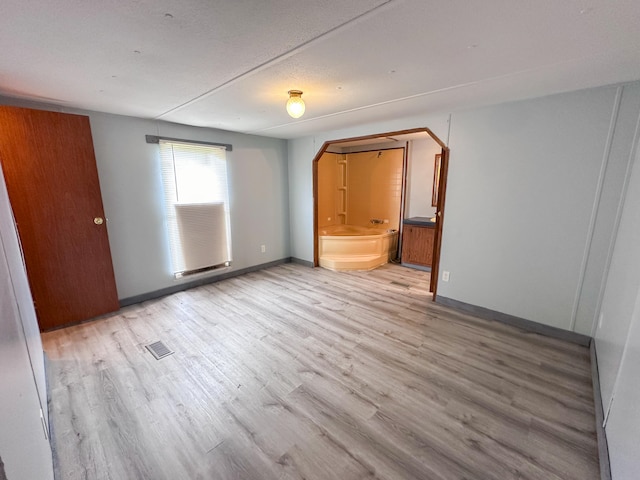 empty room with light wood-type flooring