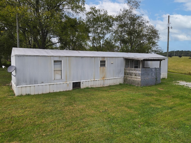 view of outbuilding featuring a yard