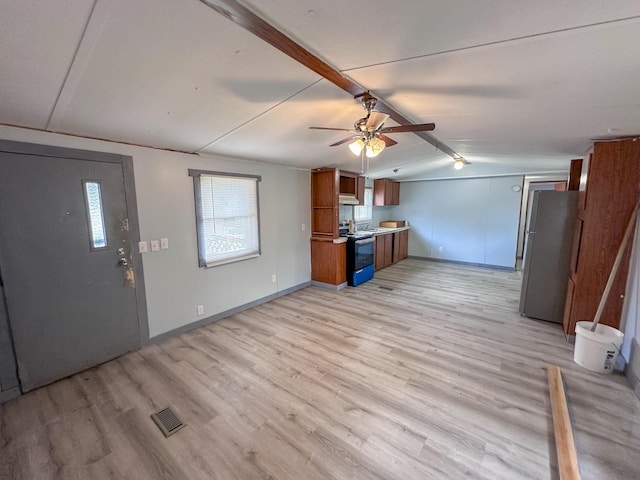 interior space with ceiling fan, light hardwood / wood-style flooring, and vaulted ceiling