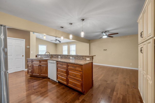 kitchen featuring white dishwasher, ceiling fan, dark hardwood / wood-style floors, and decorative light fixtures