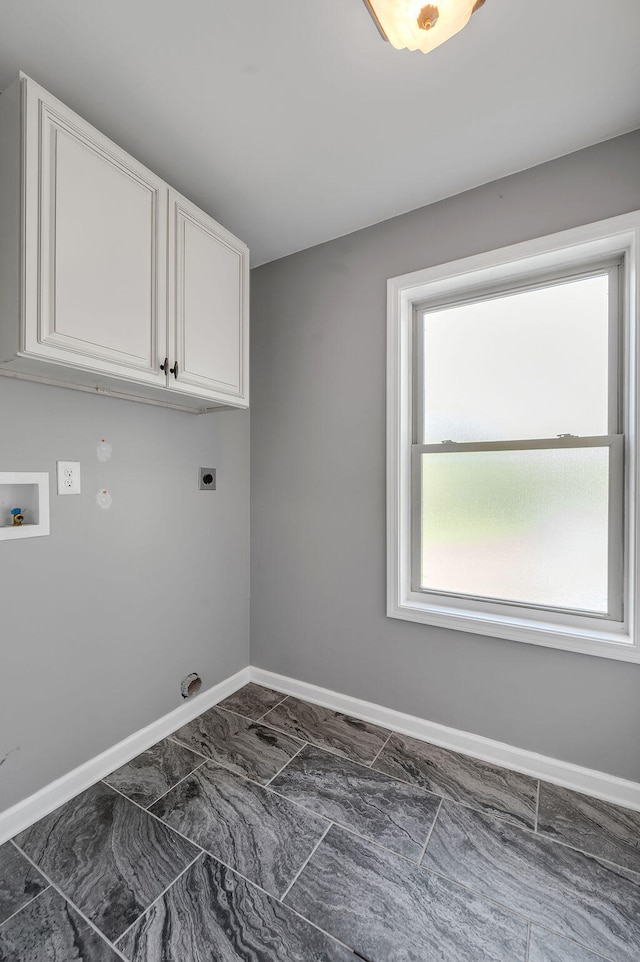 laundry area featuring cabinets, electric dryer hookup, and washer hookup