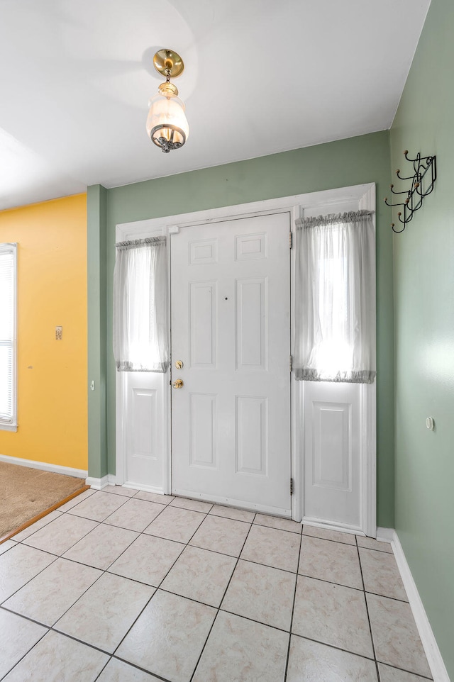 entrance foyer with light tile patterned floors