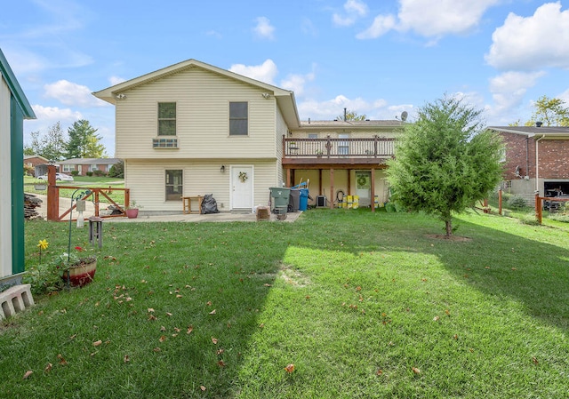 back of house featuring a yard and a patio