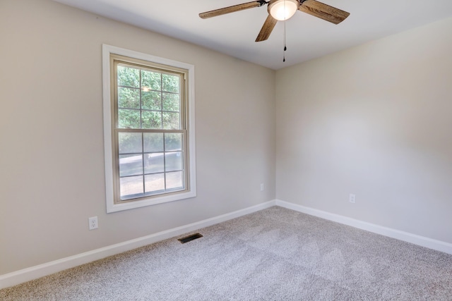 spare room featuring carpet flooring and ceiling fan