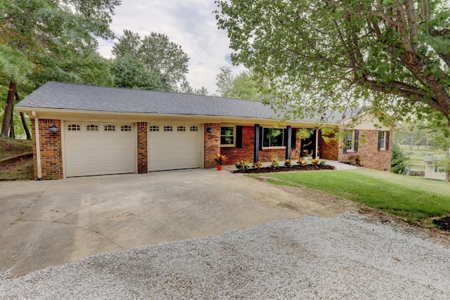 ranch-style home featuring a garage and a front yard