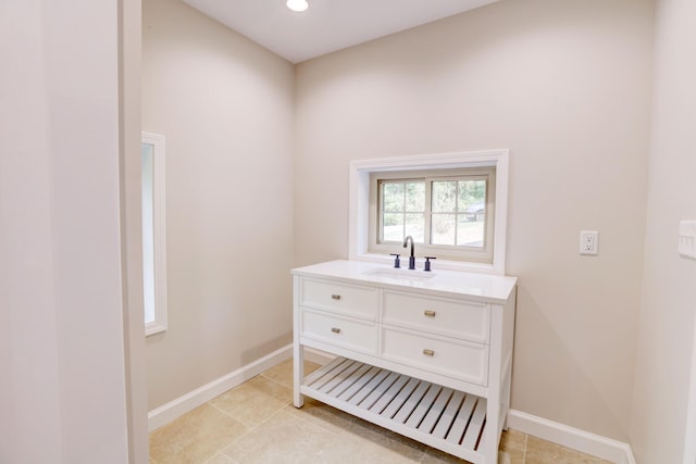 bathroom featuring tile patterned flooring and vanity