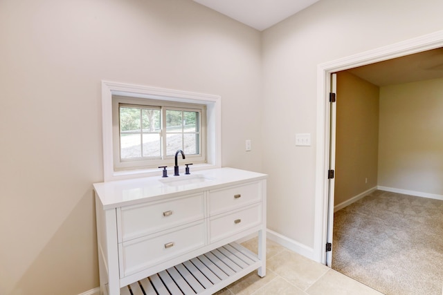 bathroom with vanity and tile patterned flooring