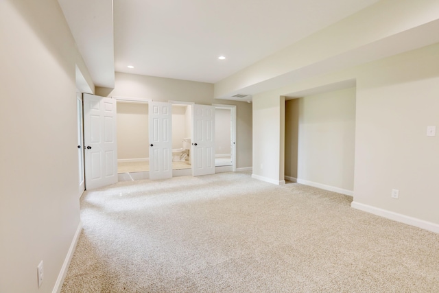 basement with light colored carpet