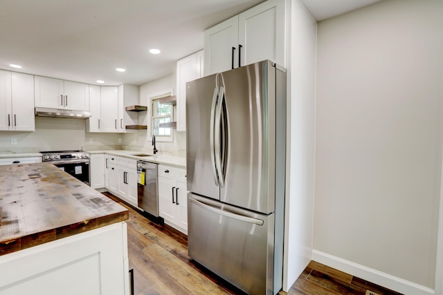 kitchen featuring light hardwood / wood-style flooring, stainless steel appliances, and white cabinetry