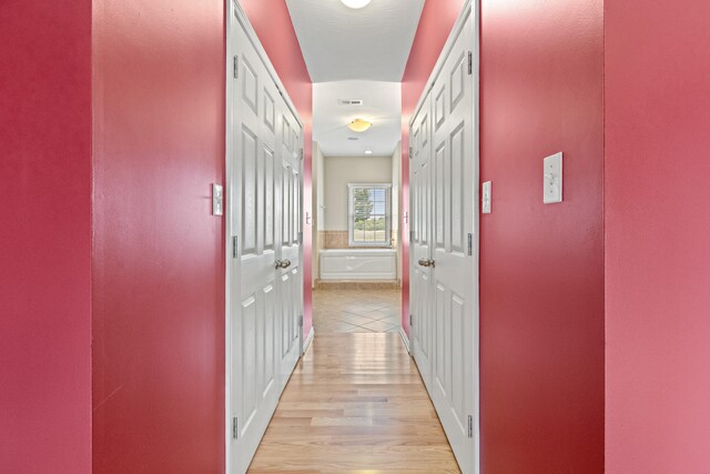 hallway featuring light hardwood / wood-style floors