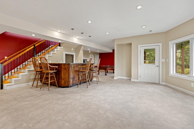 bar with carpet and decorative light fixtures