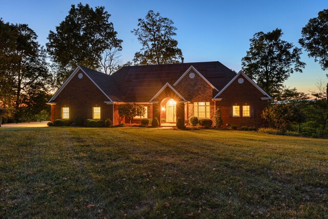 view of front of house with a yard